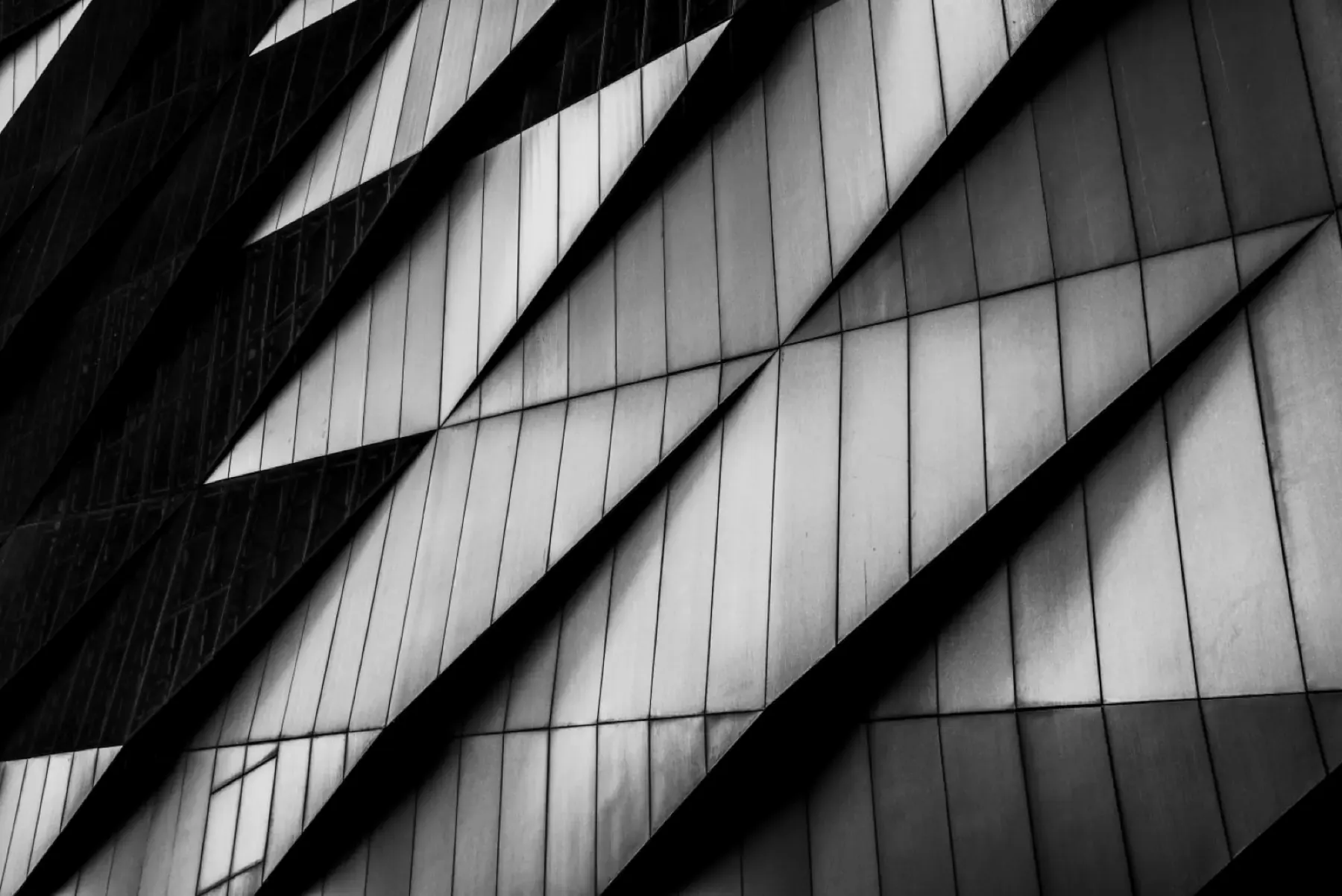 Angled metal cladding panels on a building facade