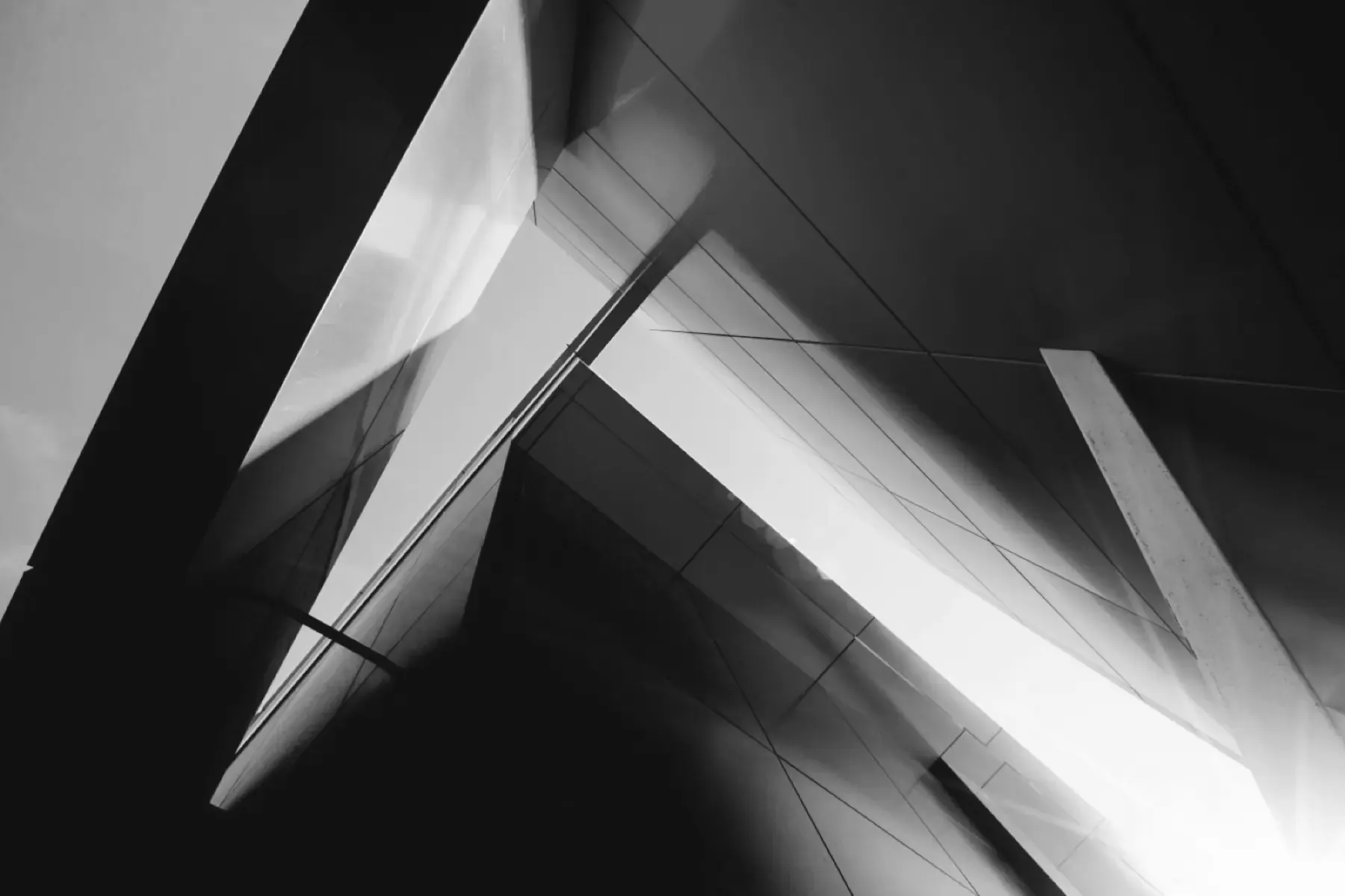 Steel and glass building edges against the sky