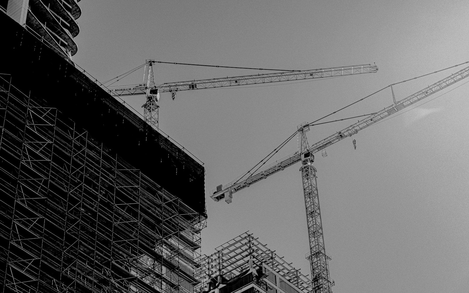 Tower cranes over a building under construction