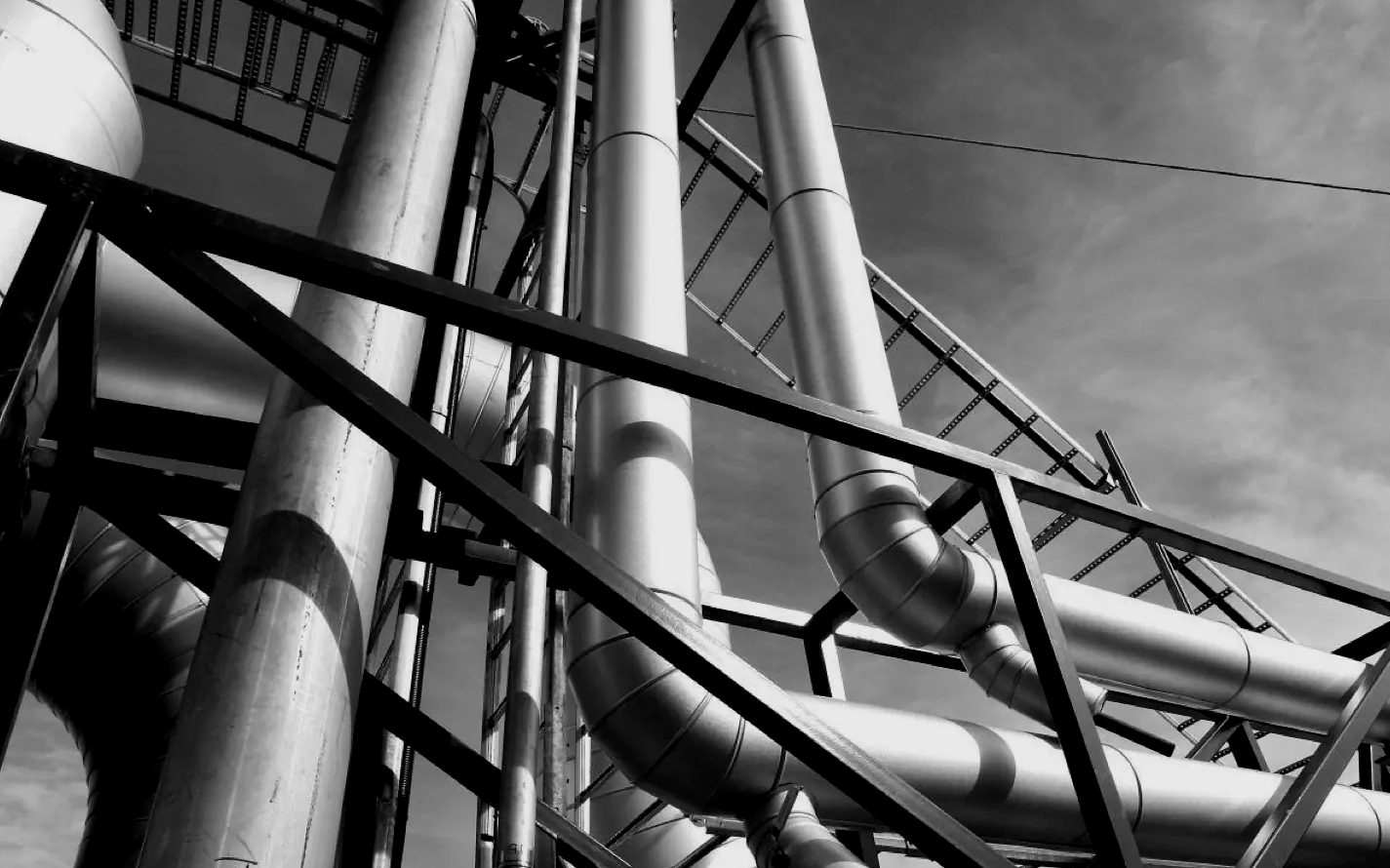 Steel pipework rising against the sky