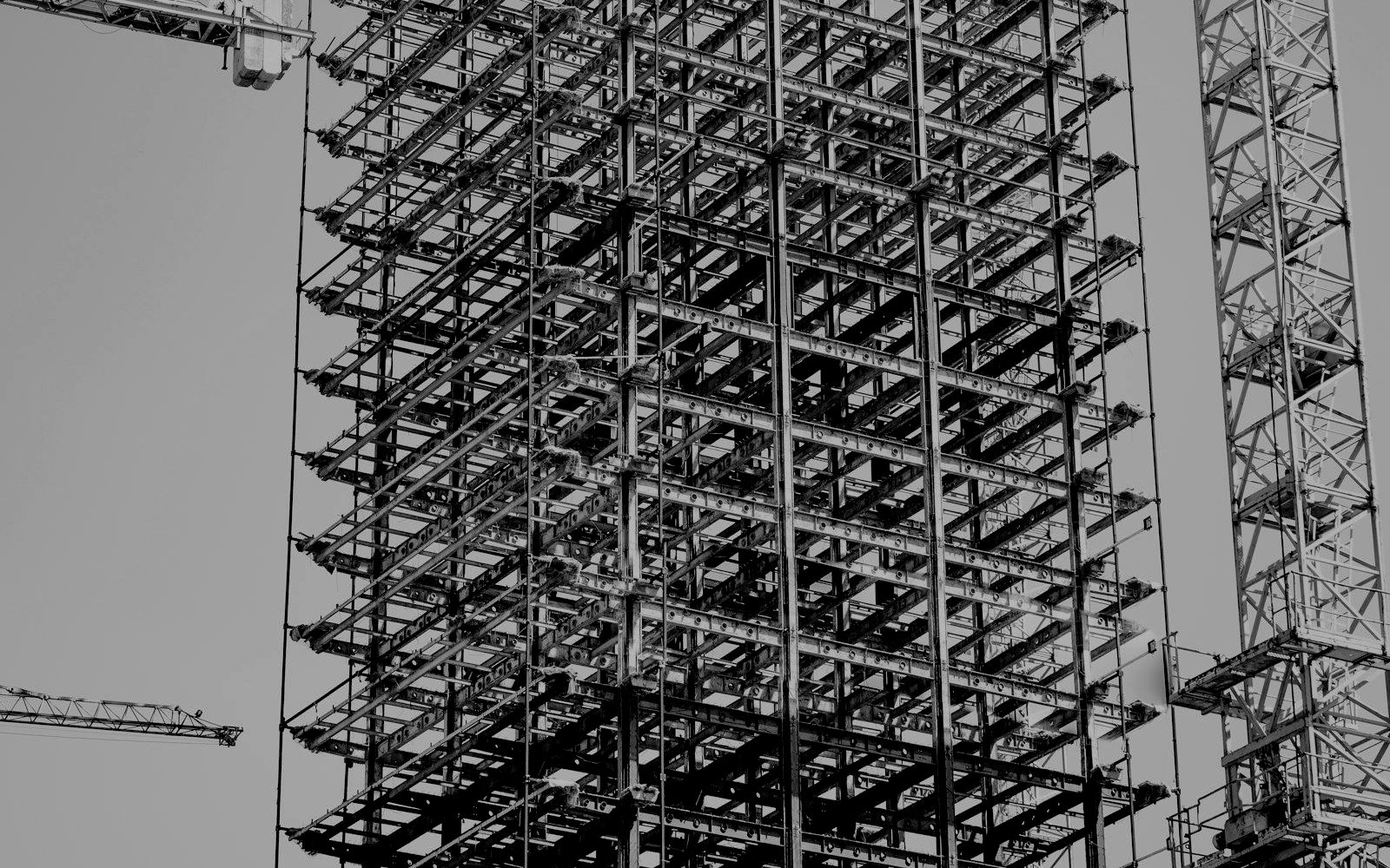 A building frame wrapped in scaffolding